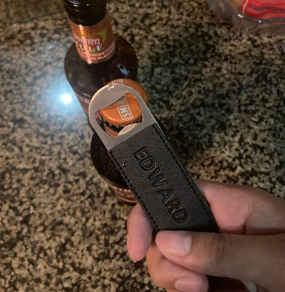 Bottle opener with leather sleeves